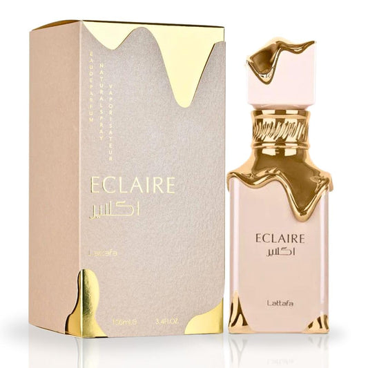 Confezione e bottiglia di Lattafa Eclaire EDP, il celebre profumo dolce e cremoso ispirato a Bianco Latte